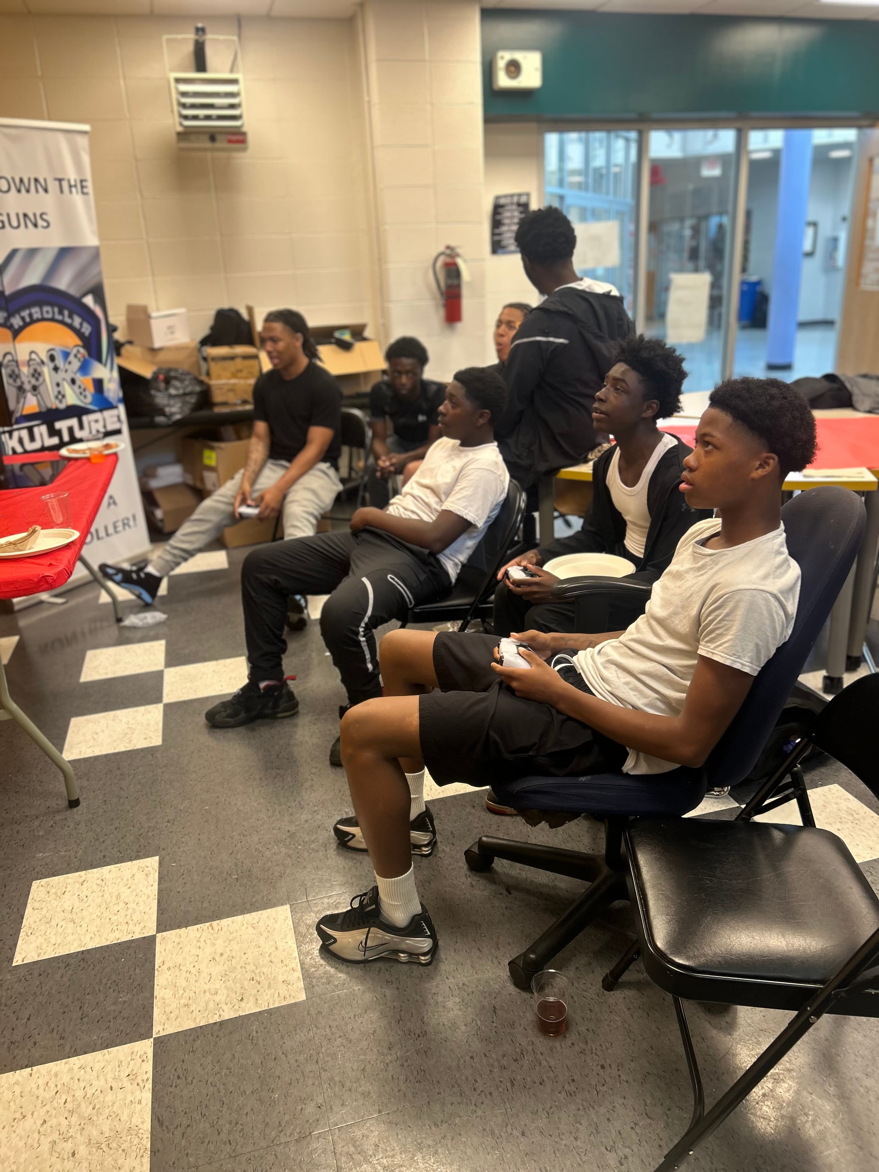 Youth engaged in competitive gaming at Kontroller Kulture program